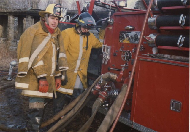 March 1985 - Trey Kelsey (left), Captain Bill Watson and Engine 158 (1961 Maxim) working at Conyer's Farm fire.